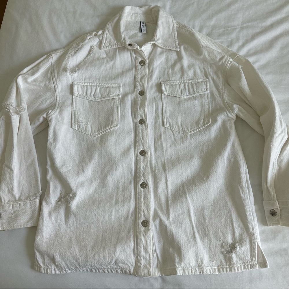 Distressed white denim jacket